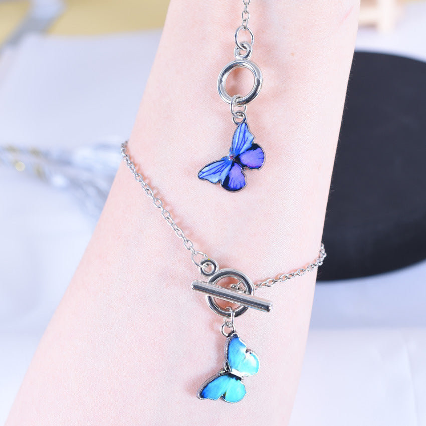 Pulsera fantasía mariposa azul, con hebilla